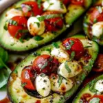 Caprese stuffed avocado bites with tomatoes and basil