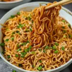 Bowl of easy saucy ramen topped with ingredients and a thick sauce