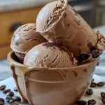 Homemade coffee ice cream served in a bowl with coffee beans