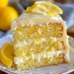 Heavenly Lemon Cake with bright frosting and lemon slices on top
