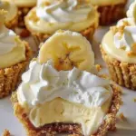 No-bake mini banana cream pies topped with whipped cream and slices of banana
