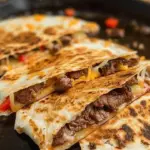 Savory steak and cheese quesadillas served on a plate