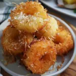 Delicious tropical coconut pineapple fritters served on a plate