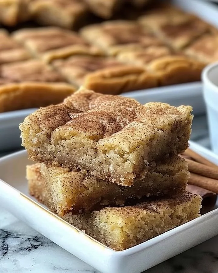 Chewy Snickerdoodle Cookie Bars fresh out of the oven, sprinkled with cinnamon sugar.