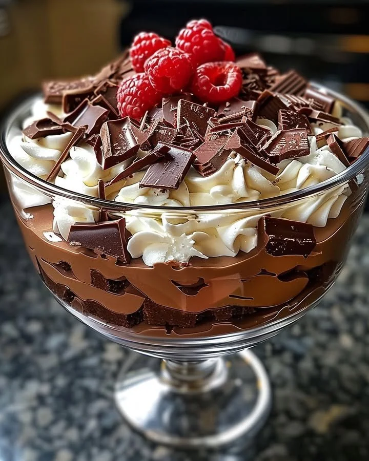 Delicious layered Baileys chocolate cheesecake topped with chocolate shavings