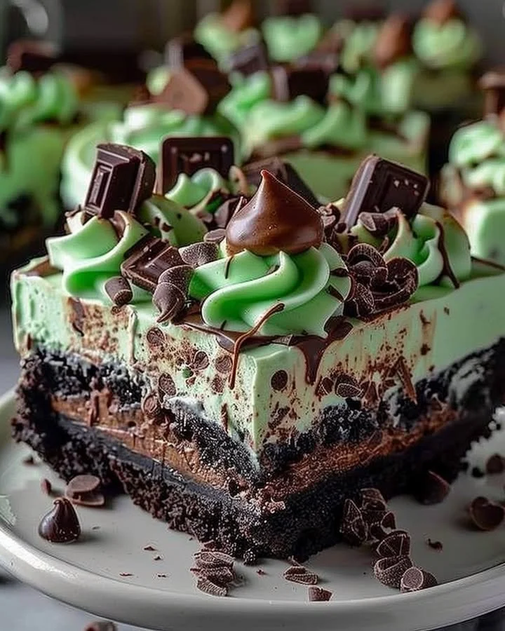 Mint Chocolate Cheesecake Fudge Cake with chocolate drizzle and mint garnish